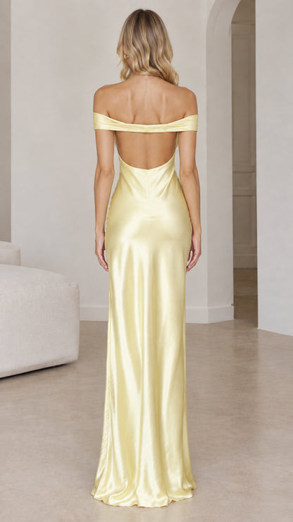 Back view of butter yellow open-back satin maxi dress