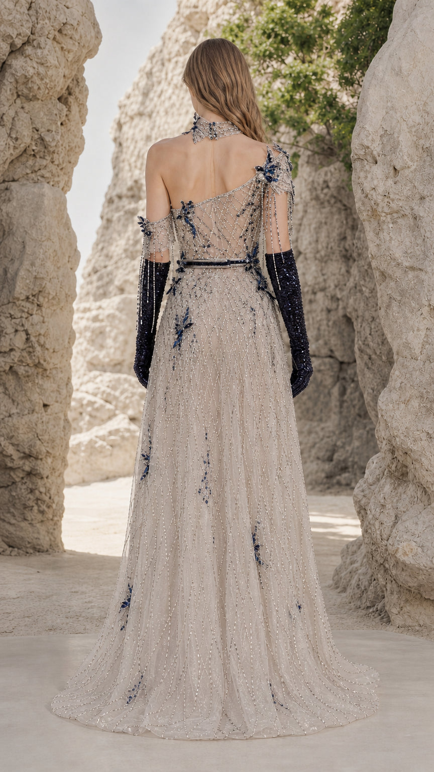 Back view of Champagne one-shoulder sequin evening dress with subtle train