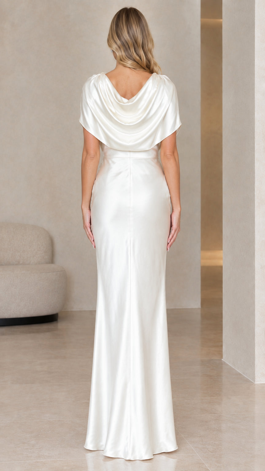Back view of ivory satin evening dress showcasing draped cowl back design