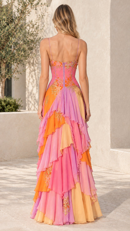 Back view of model wearing Sunset Multi tiered ruffle embroidered evening dress