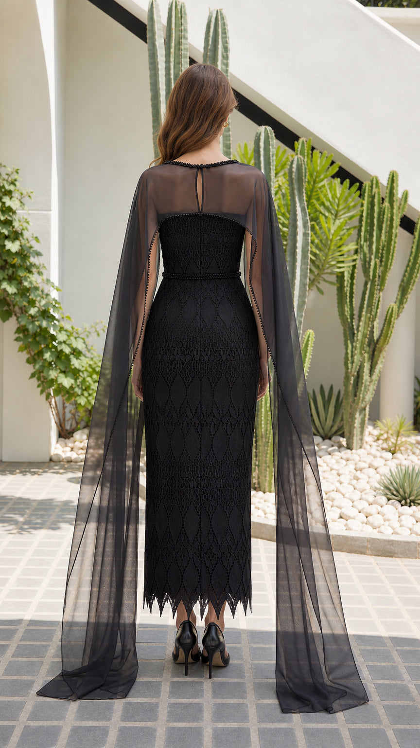 Back view of black lace sheath gown with illusion sheer cape attachment