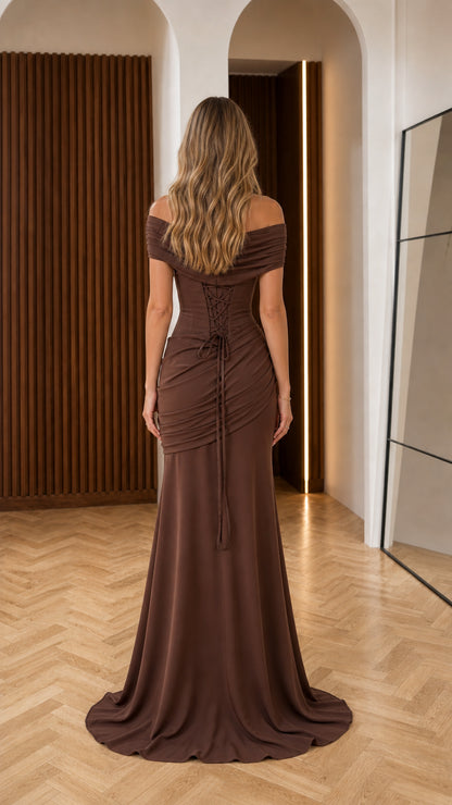 Back view of model showing lace-up corset detailing on chocolate brown evening gown