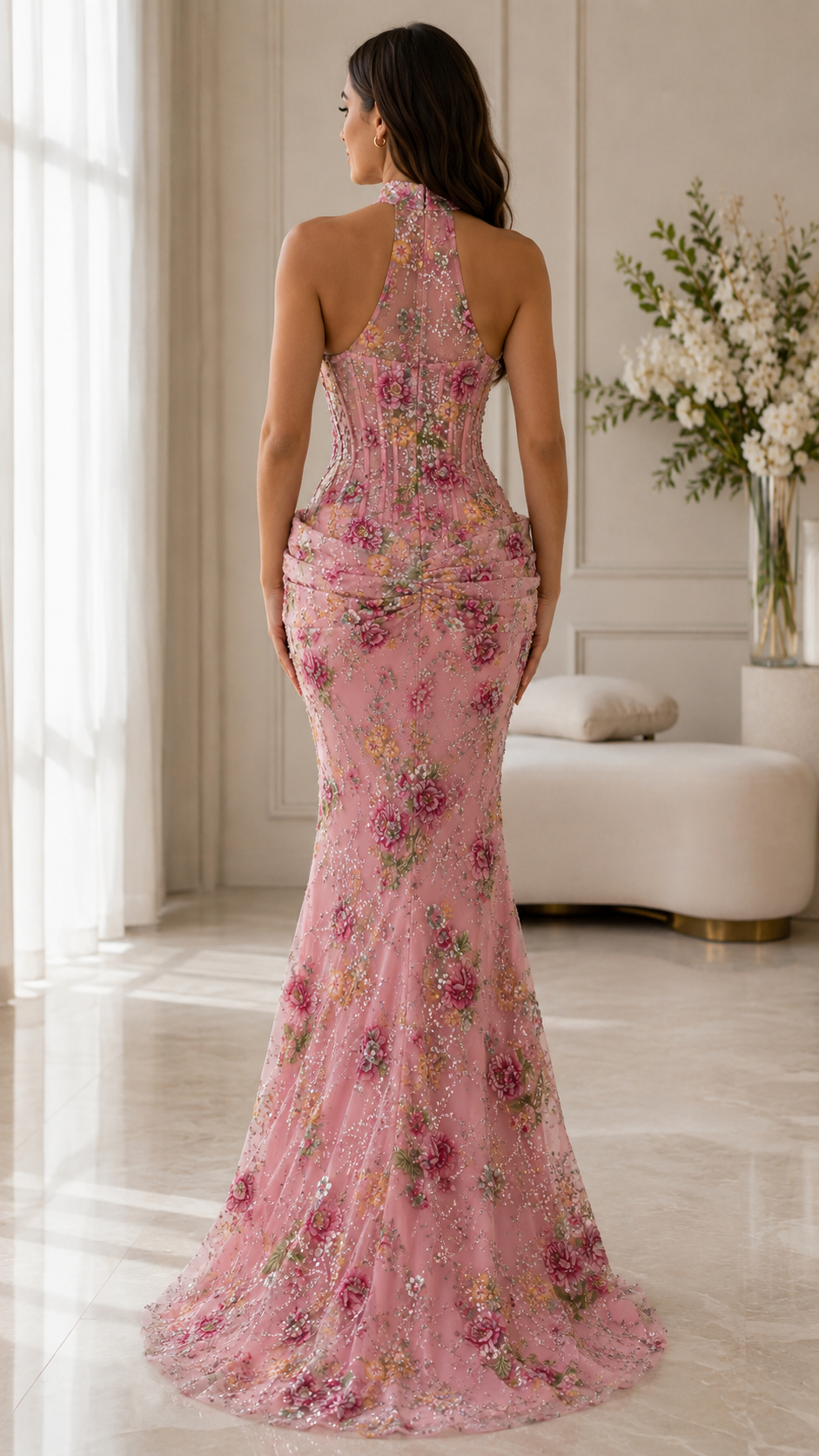 Back view of blush pink floral embellished mermaid gown with halter neckline and soft train