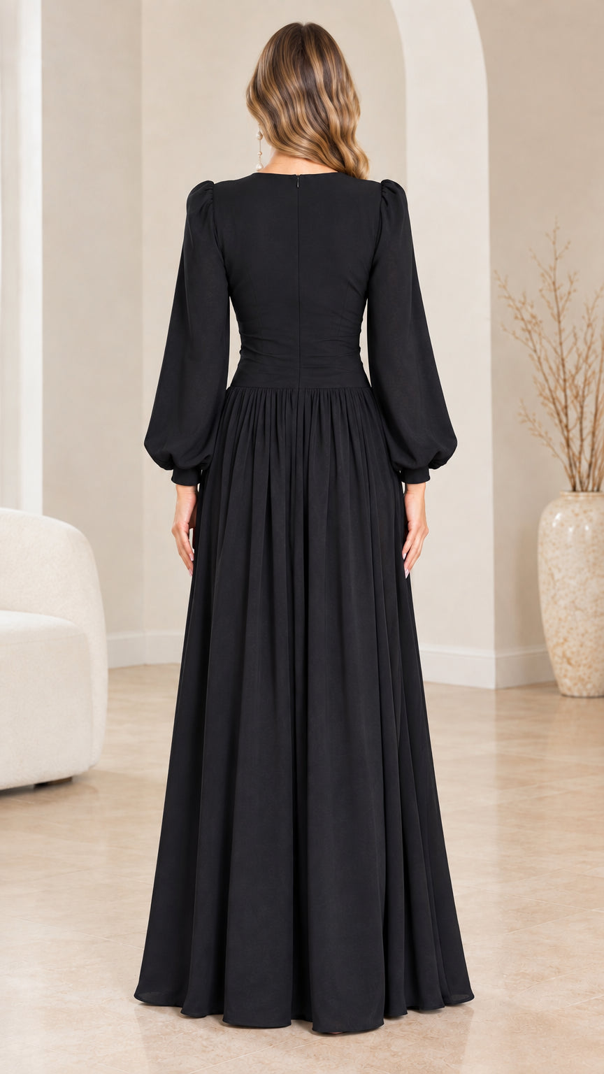 Back view of black long sleeve A-line maxi dress on model