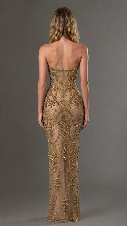 Back view of model in gold strapless beaded floor-length evening gown