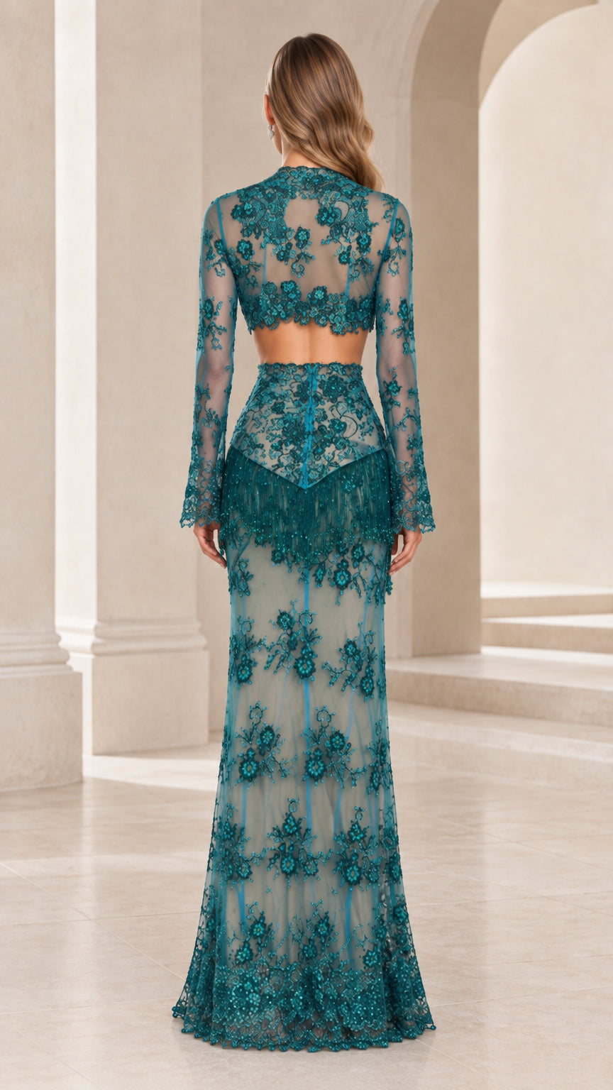 Back view of model wearing Teal long sleeve lace crop top and floor-length skirt