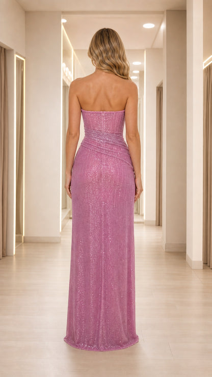 Back view of model wearing dusty rose strapless floor length evening gown