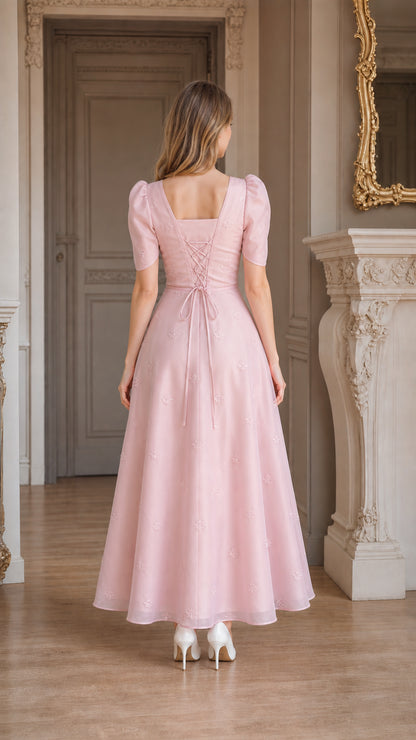 Back view of blush pink dress showing adjustable lace-up corset tie back