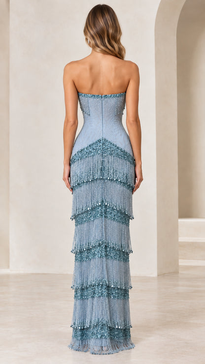 Back view of woman in dusty blue strapless column evening gown