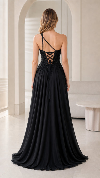 Back view of black floor-length evening gown showing lace-up corset detail