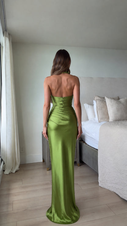 Back view of open back olive green satin floor-length dress