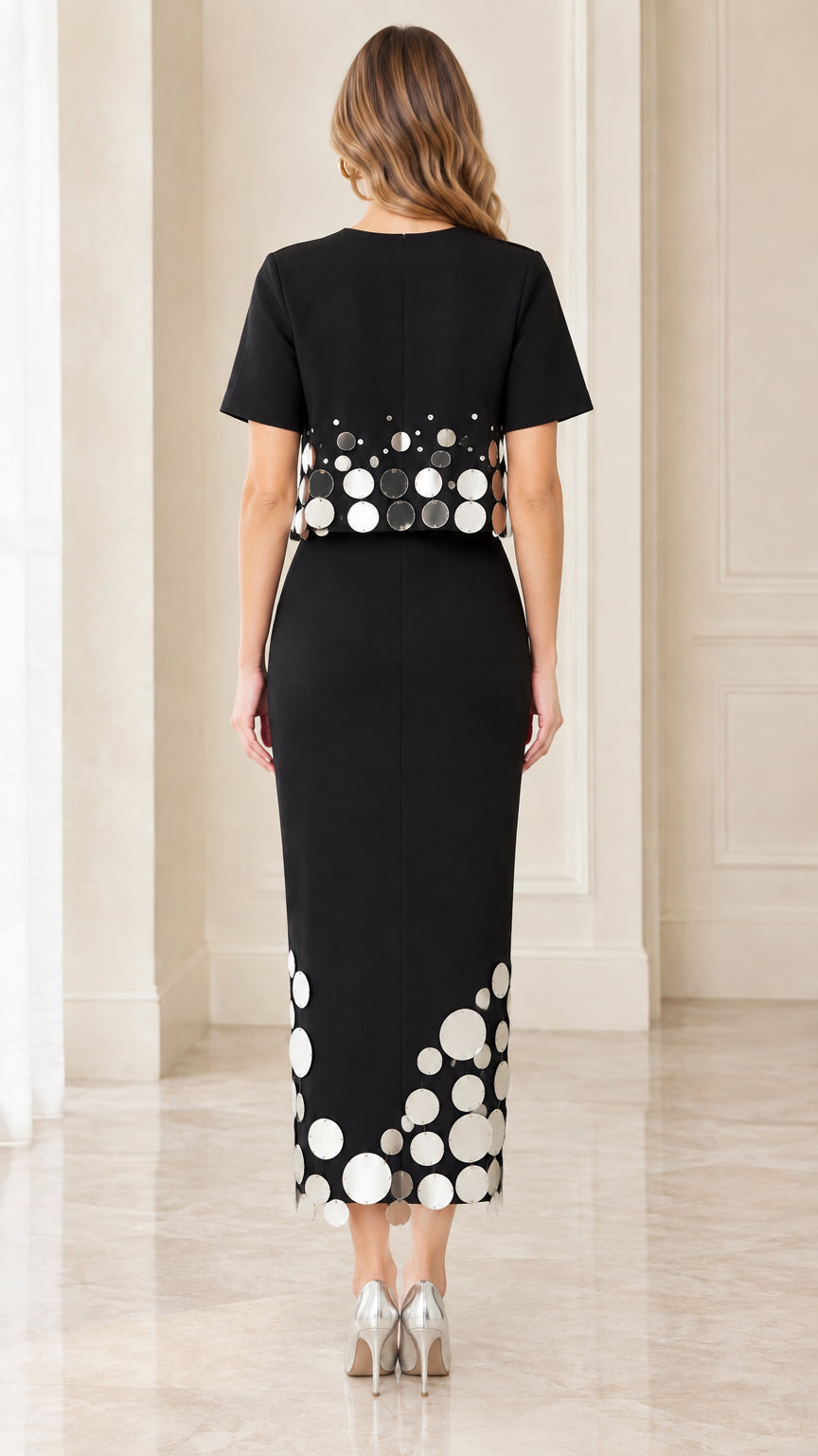 Back view of black layered midi dress with back hem slit