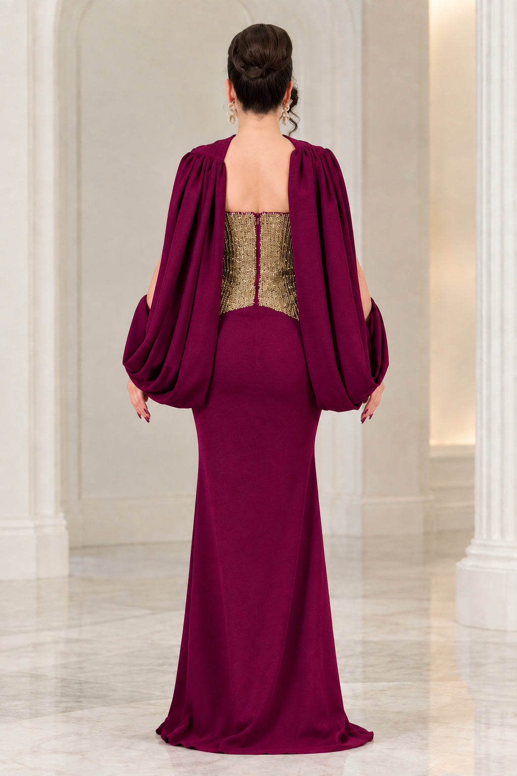 Burgundy formal dress back view highlighting draped back cape and sleek mermaid skirt