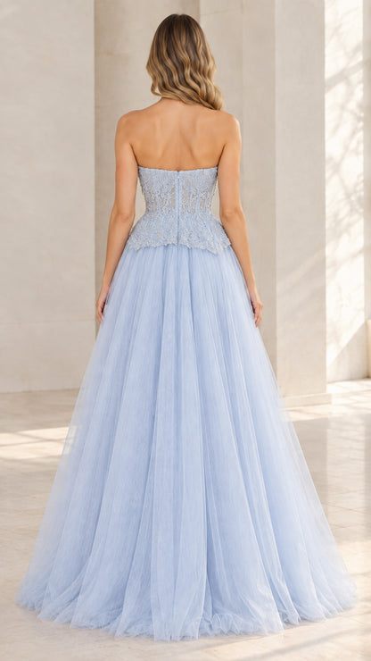 Back view of model wearing light blue strapless tulle ball gown