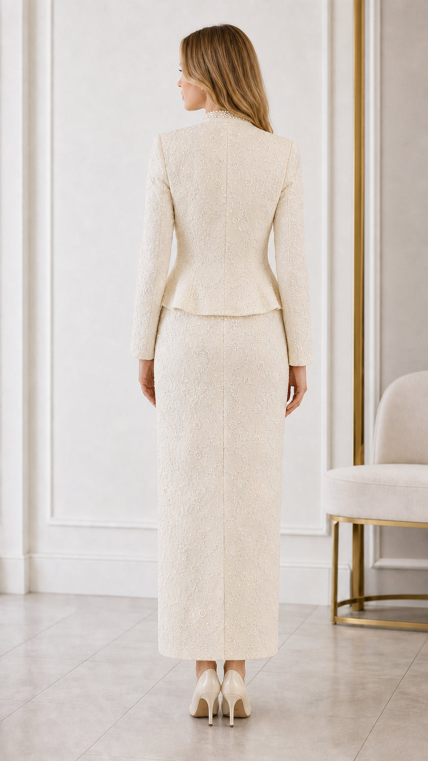 Back view of cream tailored peplum jacket and column maxi skirt