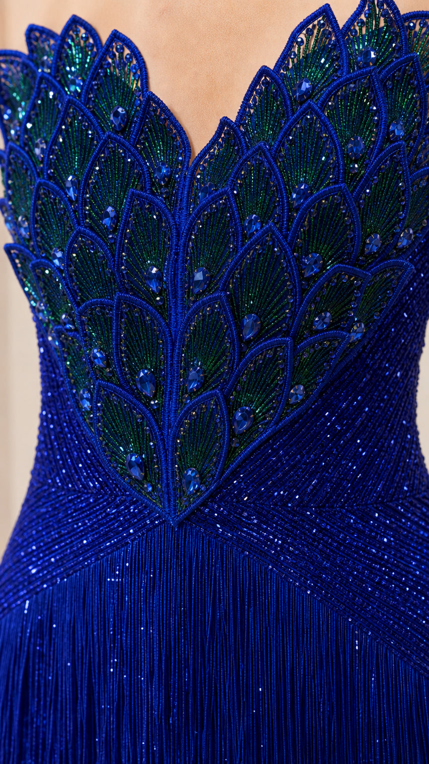 Close-up of intricate peacock feather beaded embroidery on gown bodice