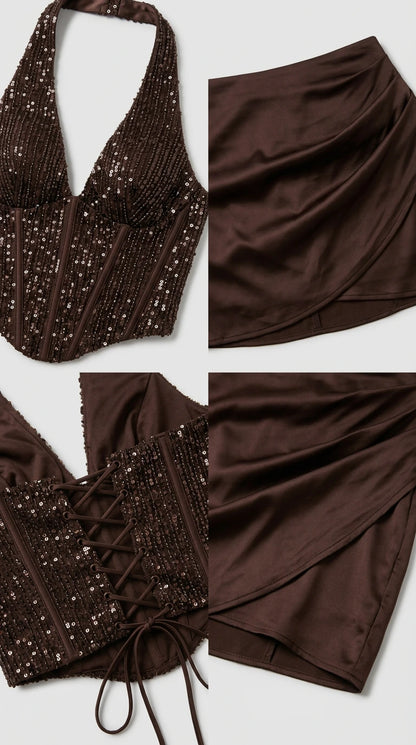 Close-up detail of chocolate brown sequin halter top, lace-up corset back, and satin skirt fabric