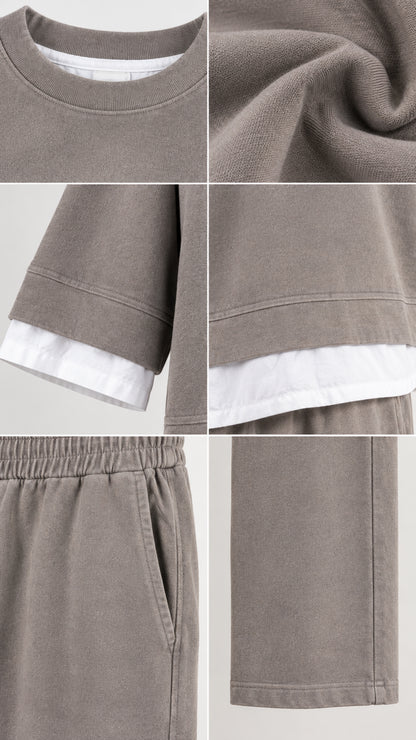 Detailed close-up view of fabric texture, contrast hem, pocket, and ribbed collar