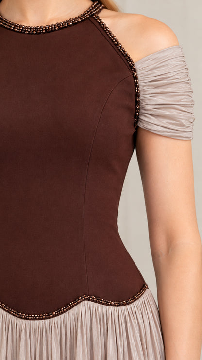 Close-up detail of beaded neckline and textured bodice of chocolate brown dress