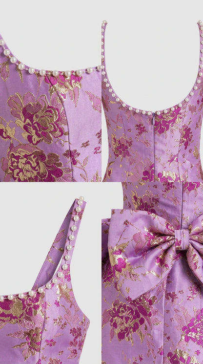 Close-up details of pearl beading, floral jacquard weave, back zipper, and bow accent