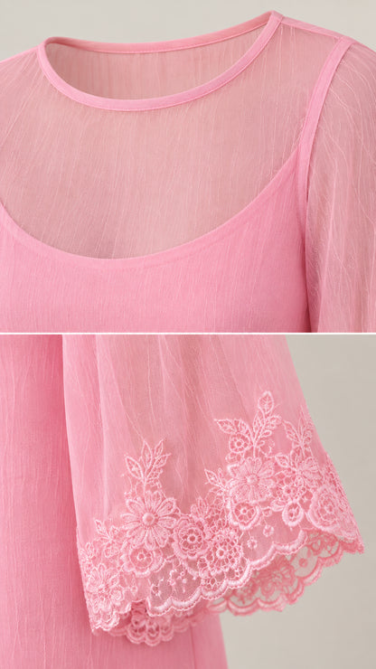 Close-up detail of sheer neckline and embroidered floral lace cuffs