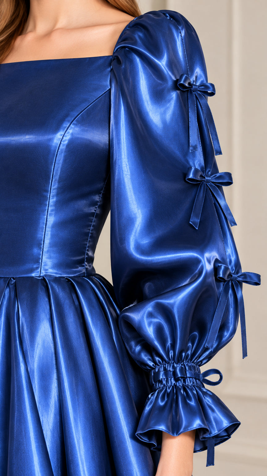 Close-up detail of Royal Blue satin bodice, square neckline, and bow-accented sleeve