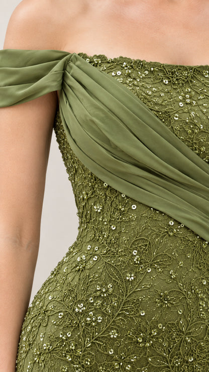Close-up detail of pleated chiffon bodice and sequin floral lace on olive green gown