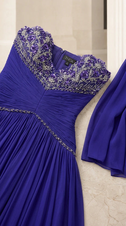 Close-up detail of beaded and crystal embroidered sweetheart neckline on royal blue chiffon gown