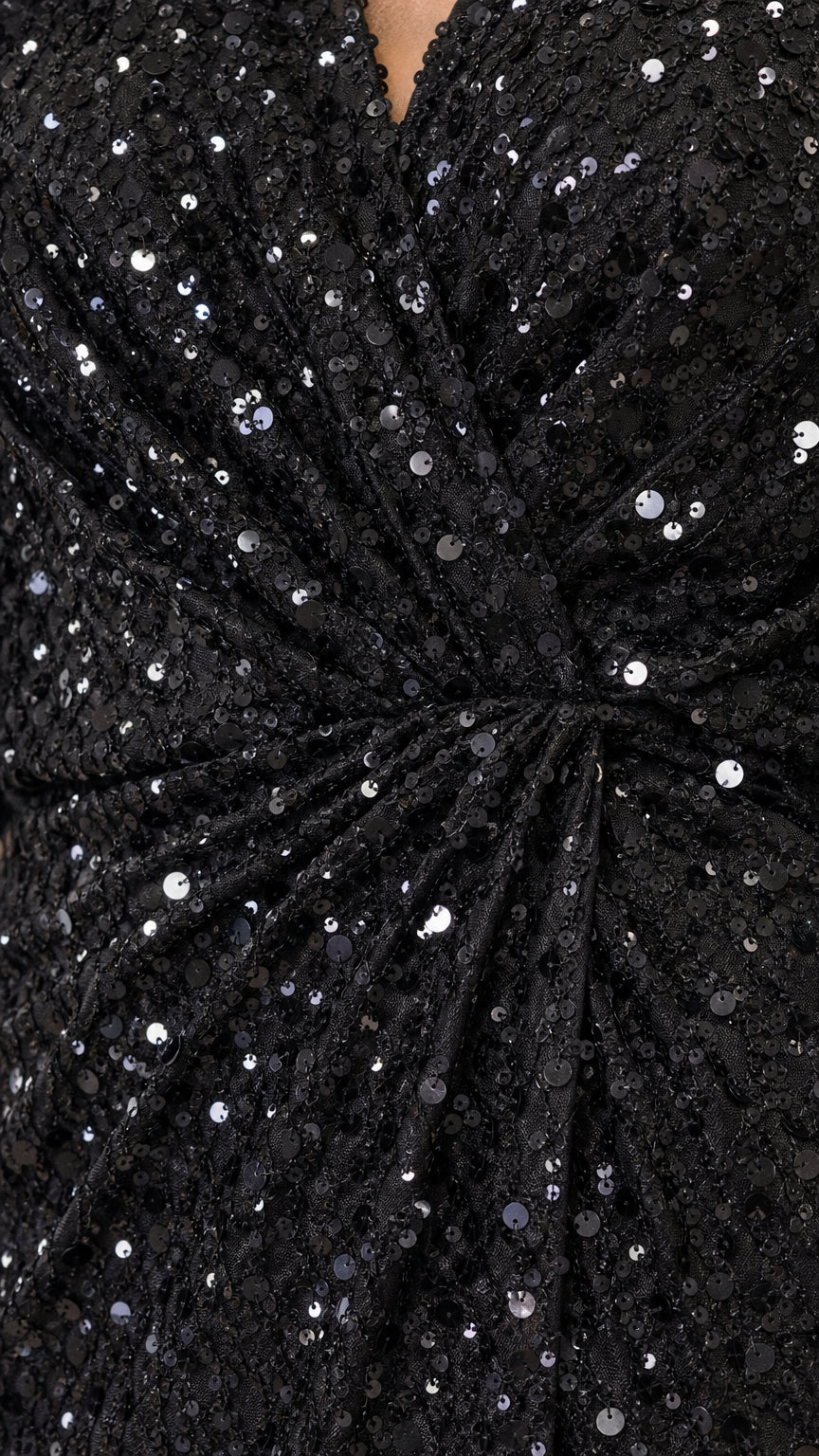 Close-up detail of black sequin fabric and gathered twist waist knot