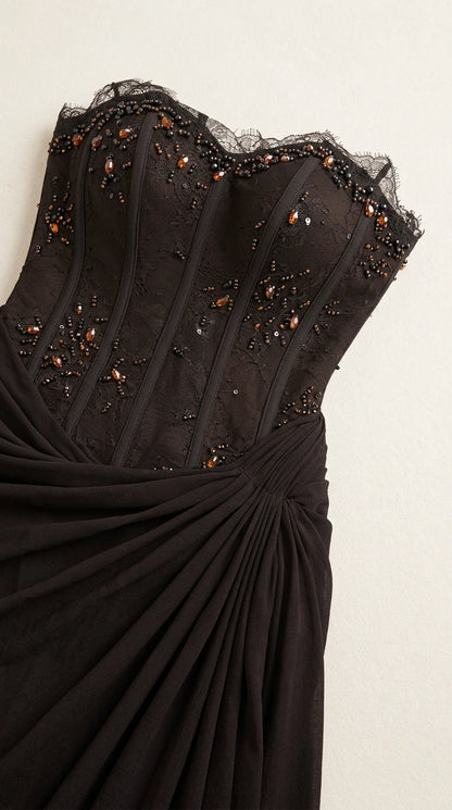 Close-up detail of beaded corset bodice with boning and lace trim