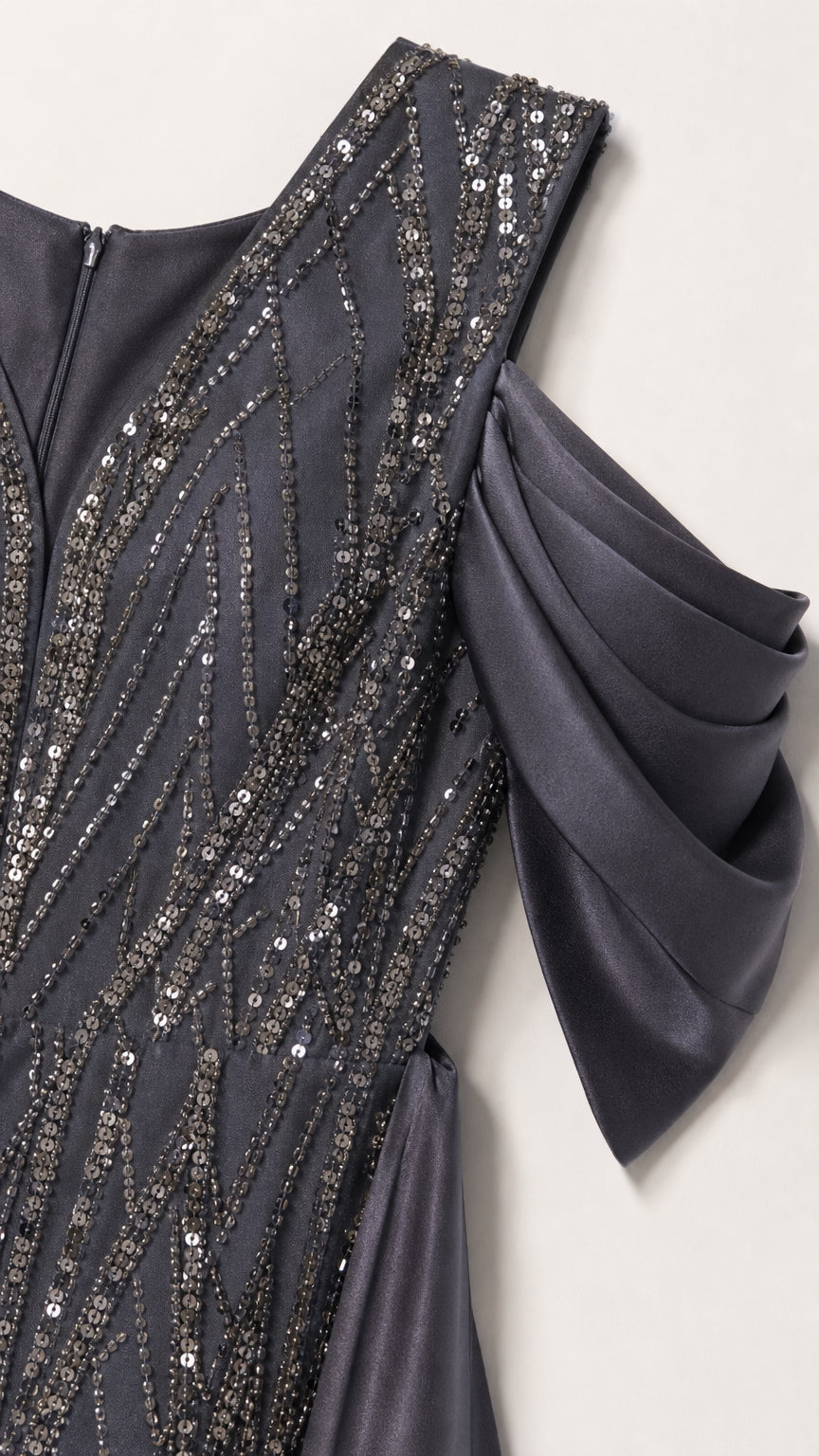 Close-up detail of Charcoal Grey sequin embroidery and pleated cold-shoulder satin sleeve