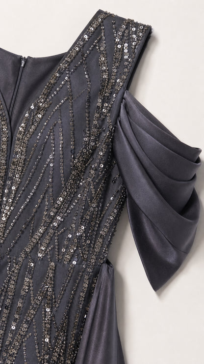 Close-up detail of Charcoal Grey sequin embroidery and pleated cold-shoulder satin sleeve