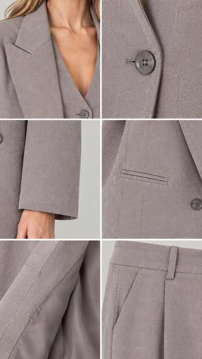 Close-up details of suit fabric, lapel, buttons, welt pockets, and trouser waistband