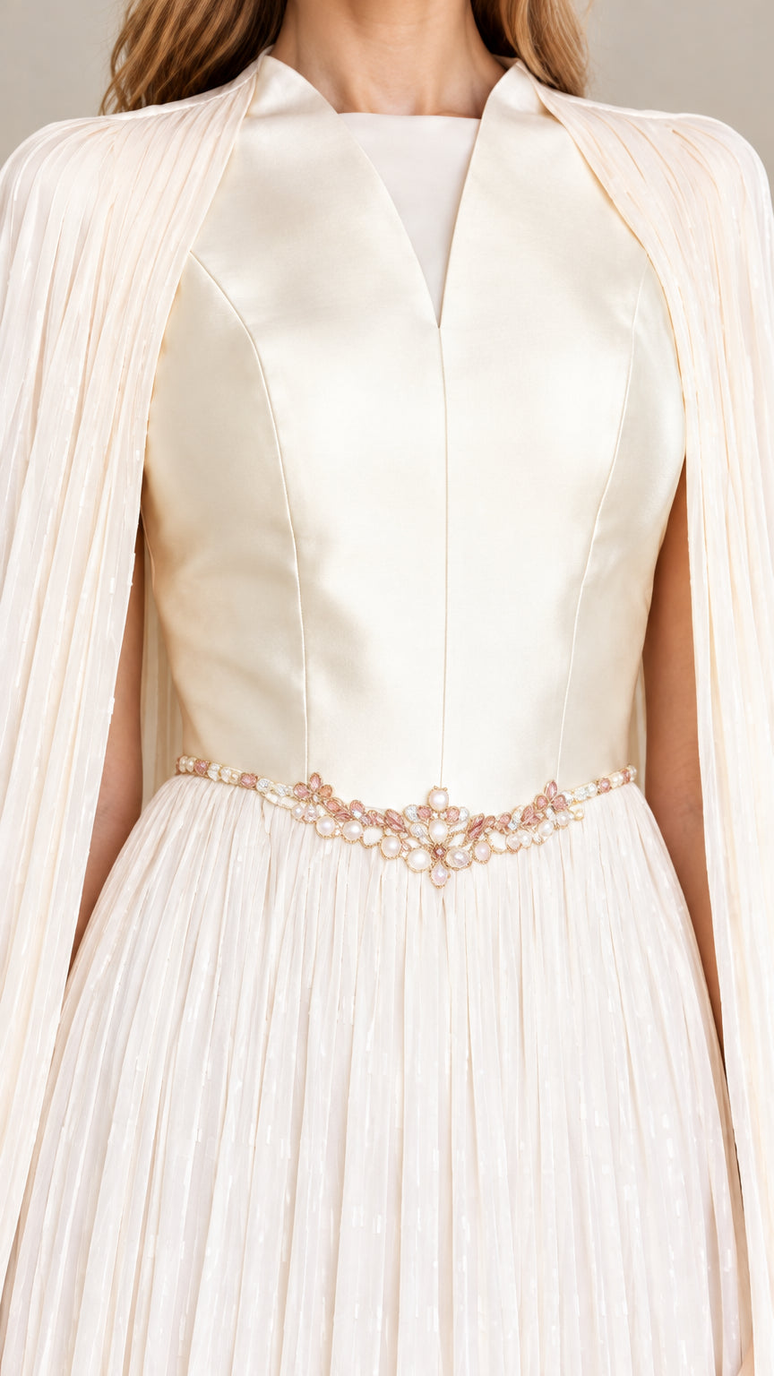 Close-up detail of satin bodice, neckline, and beaded waistband in ivory