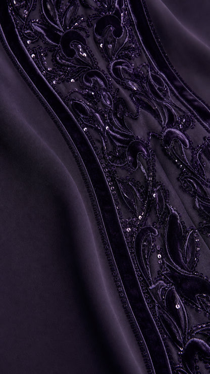 Close-up of intricate velvet scroll embroidery and sequin details on Deep Plum gown