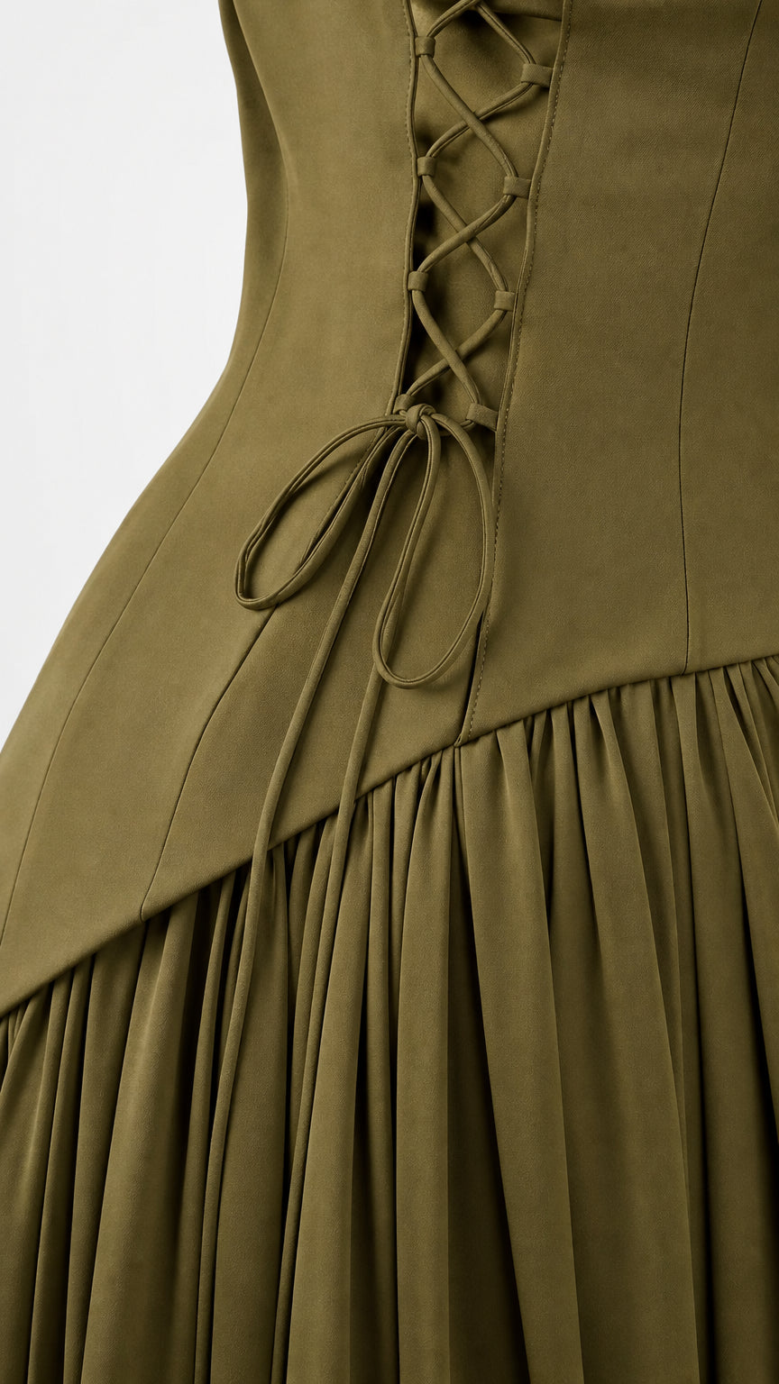 Close-up detail of olive green corset lace-up back and drop waist pleating