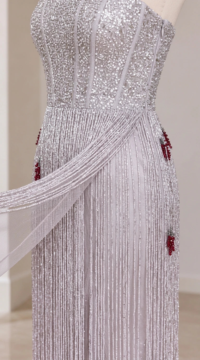 Close-up of intricate sequin and fringe beading detail