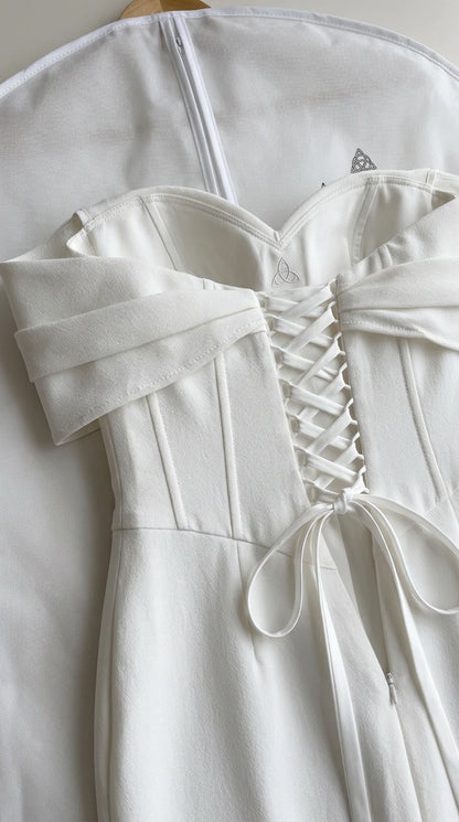 Close-up of structured corset boning and lace-up back closure