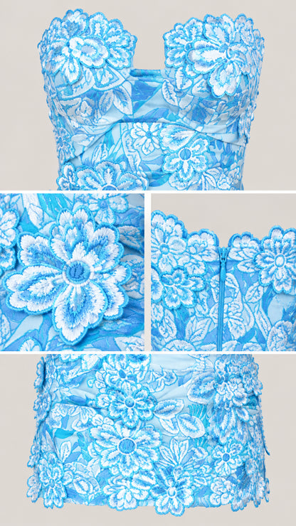 Close-up details of floral lace embroidery, scalloped neckline, and zip closure