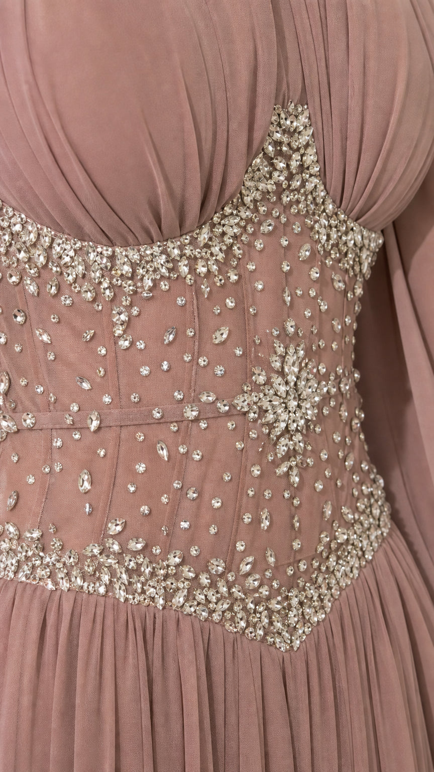 Close-up detail of intricate crystal and rhinestone embellishments on corset bodice