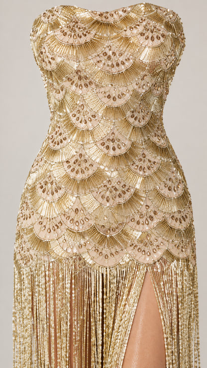 Close-up detail of Champagne Gold scallop sequin embroidery and hanging fringe tassels