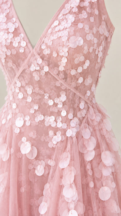 Close-up detail of blush pink bodice with layered petal paillette embellishments