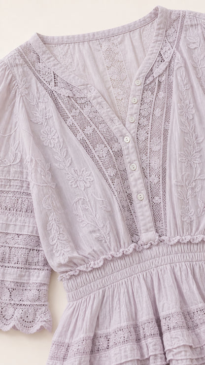 Close up of Lilac bodice showing intricate lace inserts and floral embroidery details