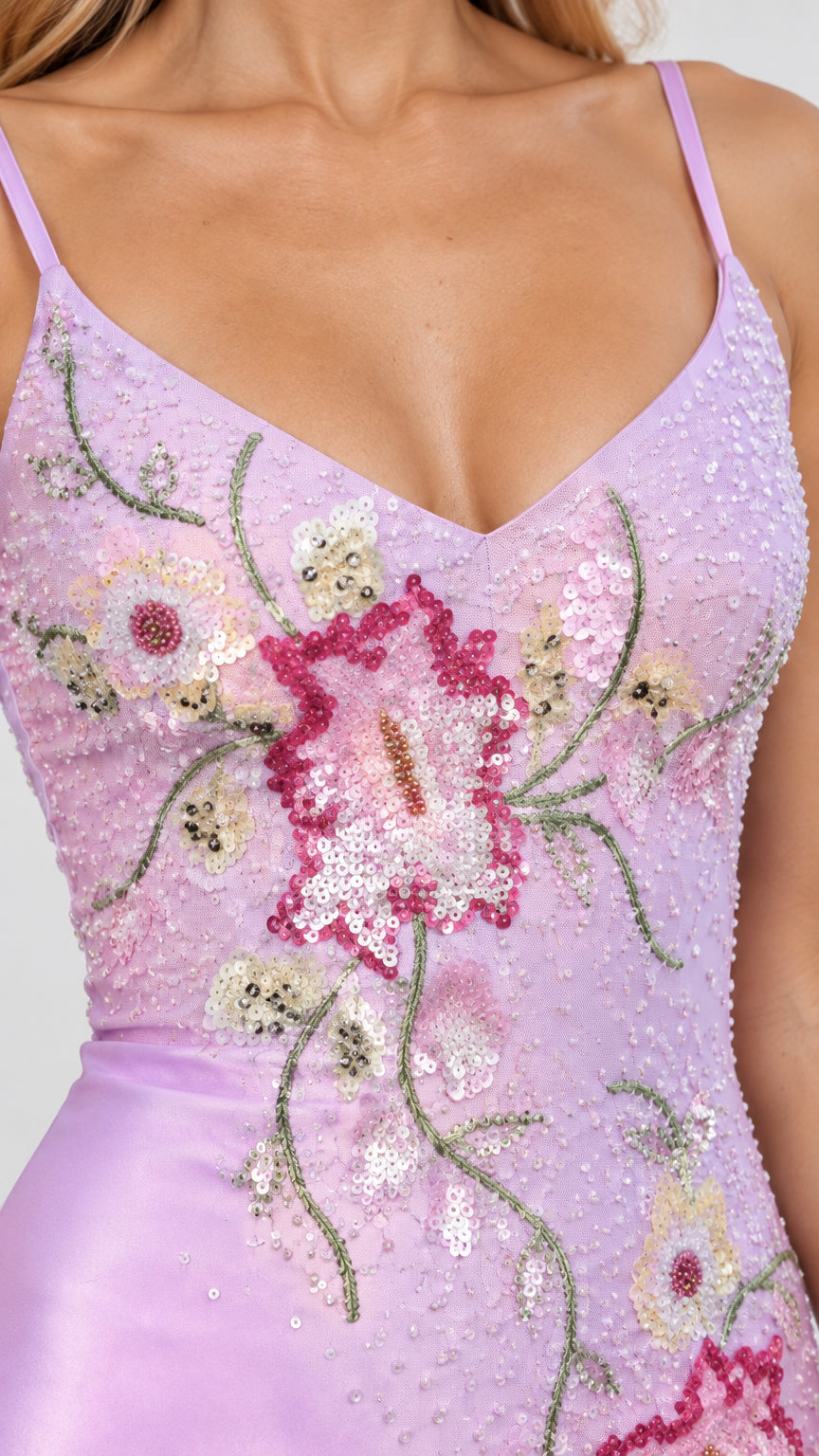 Close up of delicate floral beadwork and embroidery on bodice
