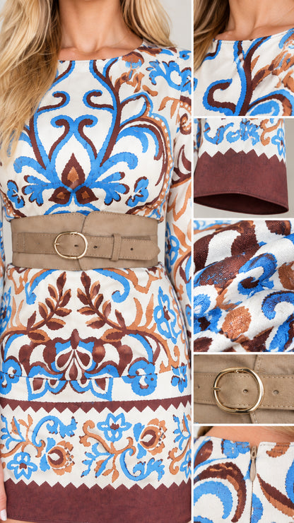 Close-up details of fabric pattern, neckline, sleeve cuff, and belt buckle