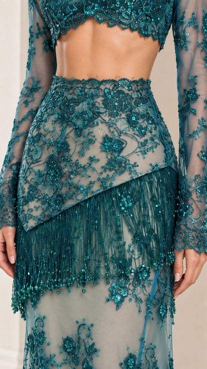 Close-up detail of Teal sequin embroidery and diagonal beaded fringe on high-waist skirt