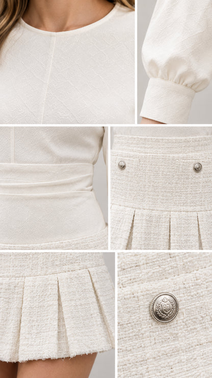 Close-up details of neckline, sleeve cuff, textured fabric, and crest button on Cream mini dress