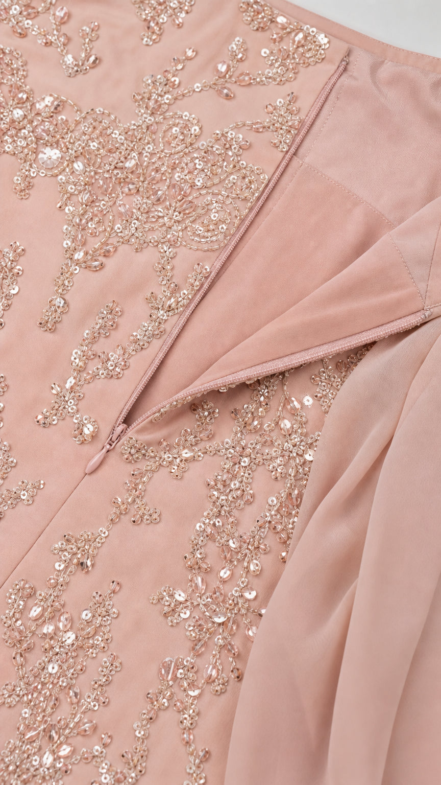 Close-up detail of delicate sequin embroidery, hidden zipper, and chiffon drape