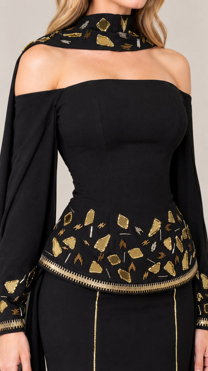 Close-up of metallic embroidered choker collar and waist detailing on black gown