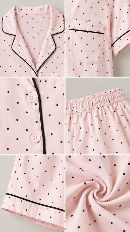 Close-up details of collar, buttons, elastic waistband, and fabric texture of pink polka dot pajamas